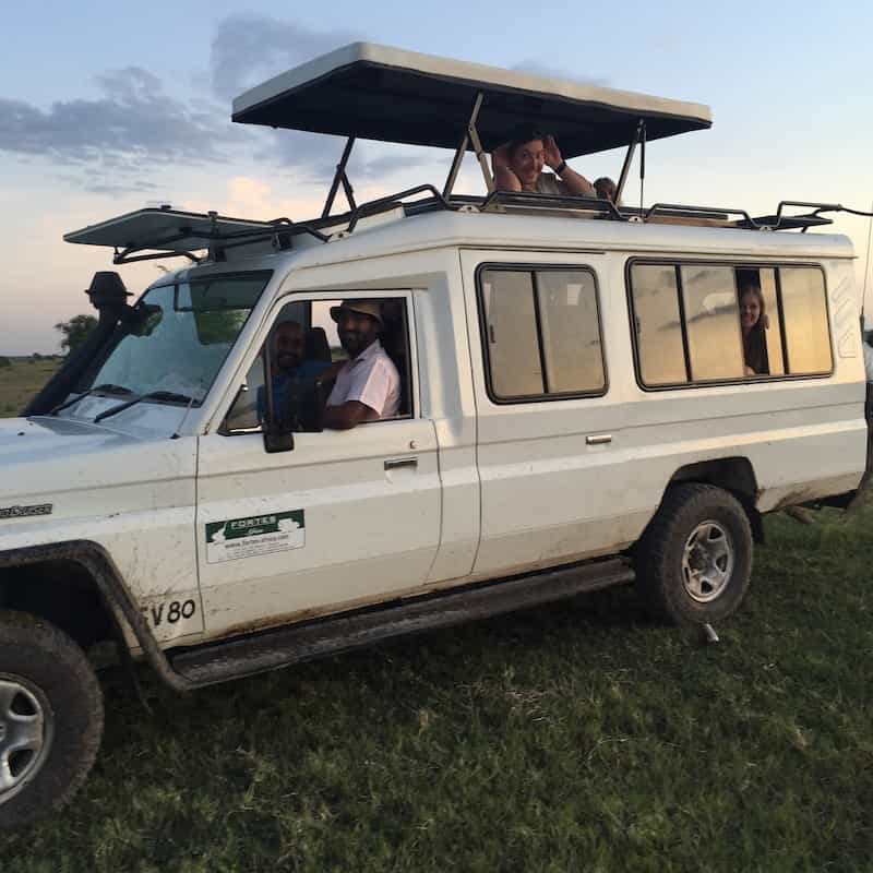 Game drive vehicle with roof open